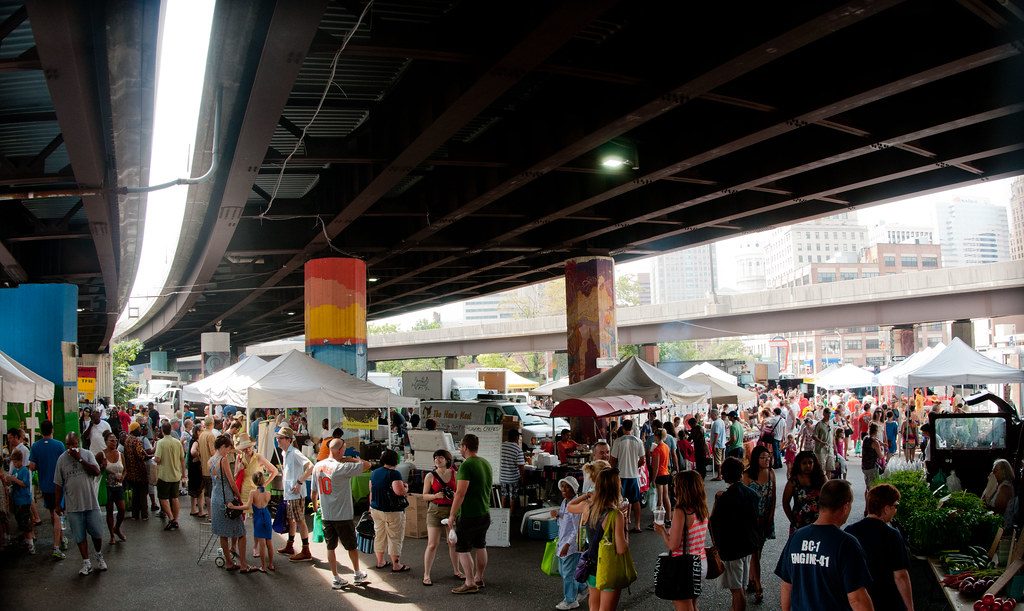 Stalls and crowds at an outdoor street market